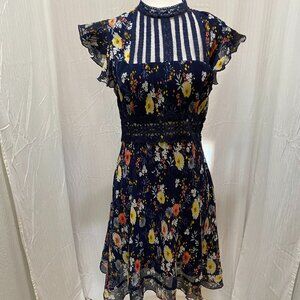 FoxieDox Flowy Navy Floral Dress. Size Small. Semi-open back.